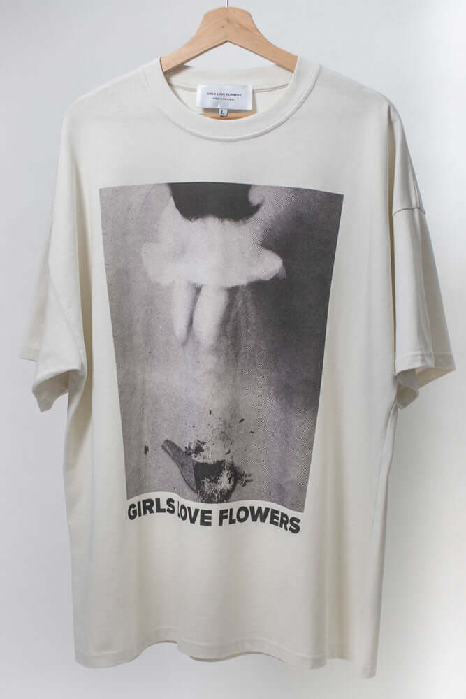 Ivory t-shirt that reads GIRLS LOVE FLOWERS