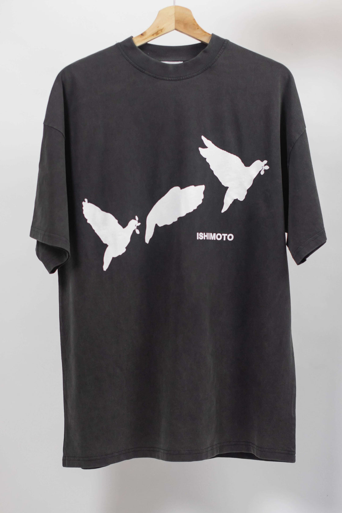 Charcoal t-shirt that has three doves flying away with text ISHIMOTO written underneath