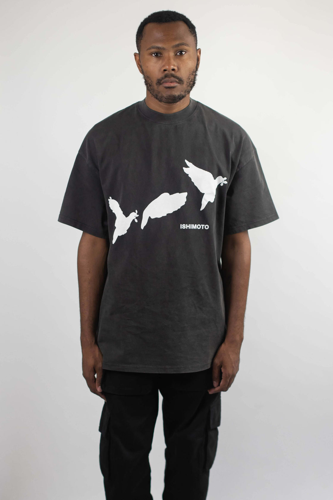 Charcoal t-shirt that has three doves flying away with text ISHIMOTO written underneath